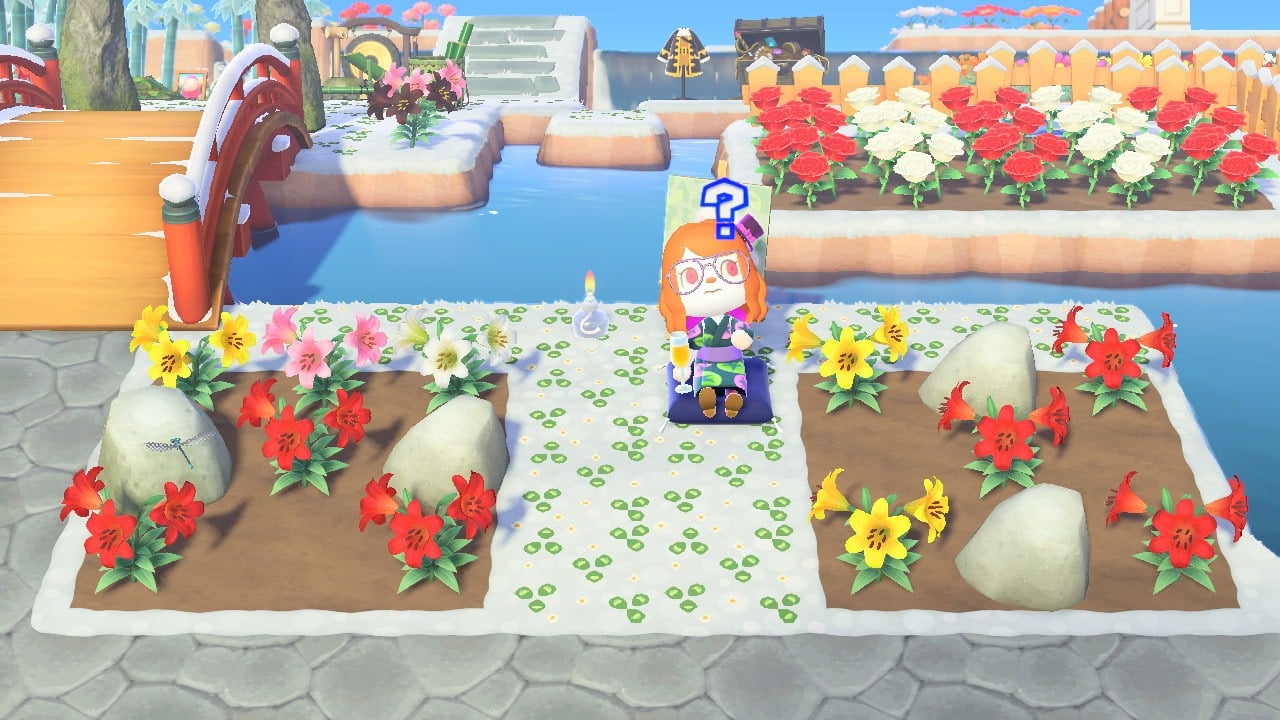 Niña sentada junto a unas rocas en Animal Crossing: New Horizons